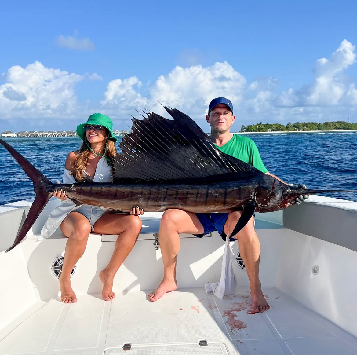 Guests with sailfish caught on charter near Vilamendhoo Island