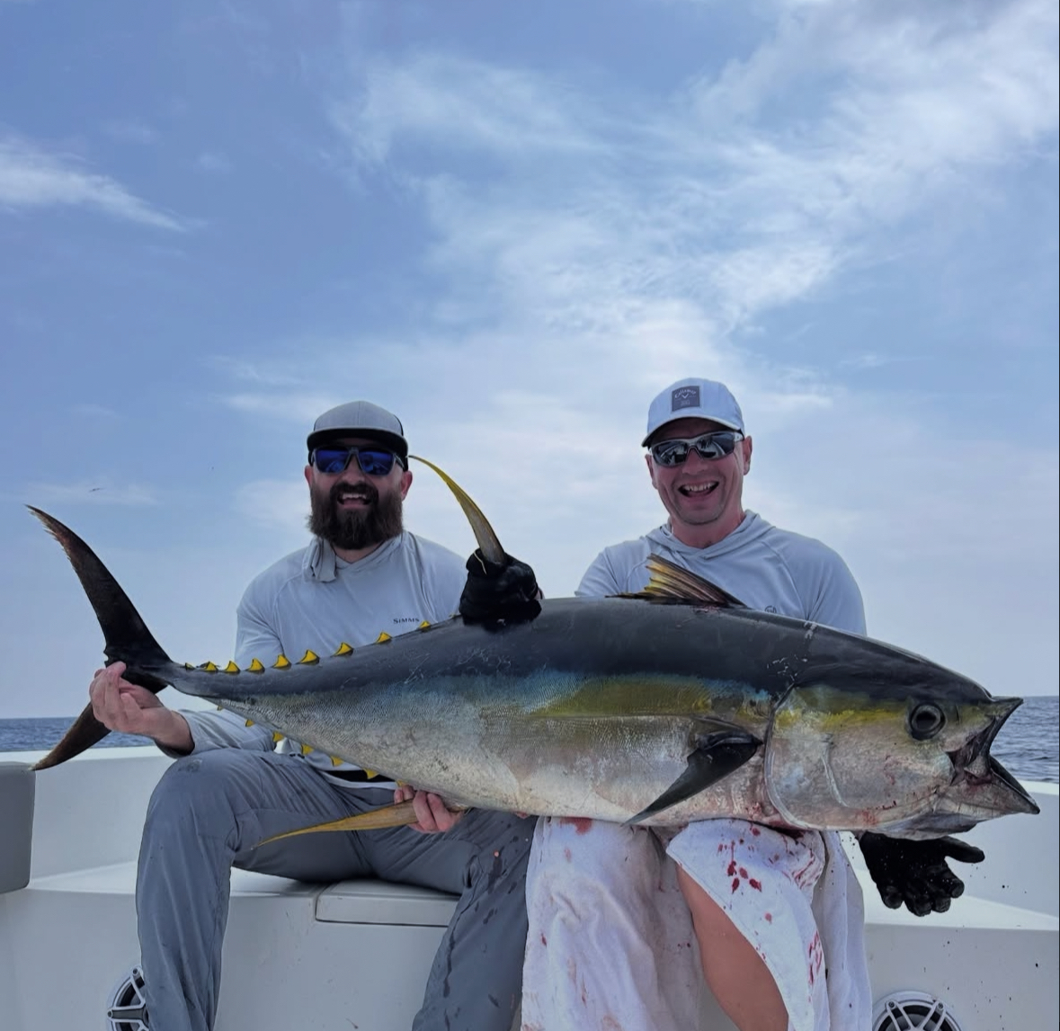 Crew holding five yellowfin tuna caught on a charter with Spear Maldives